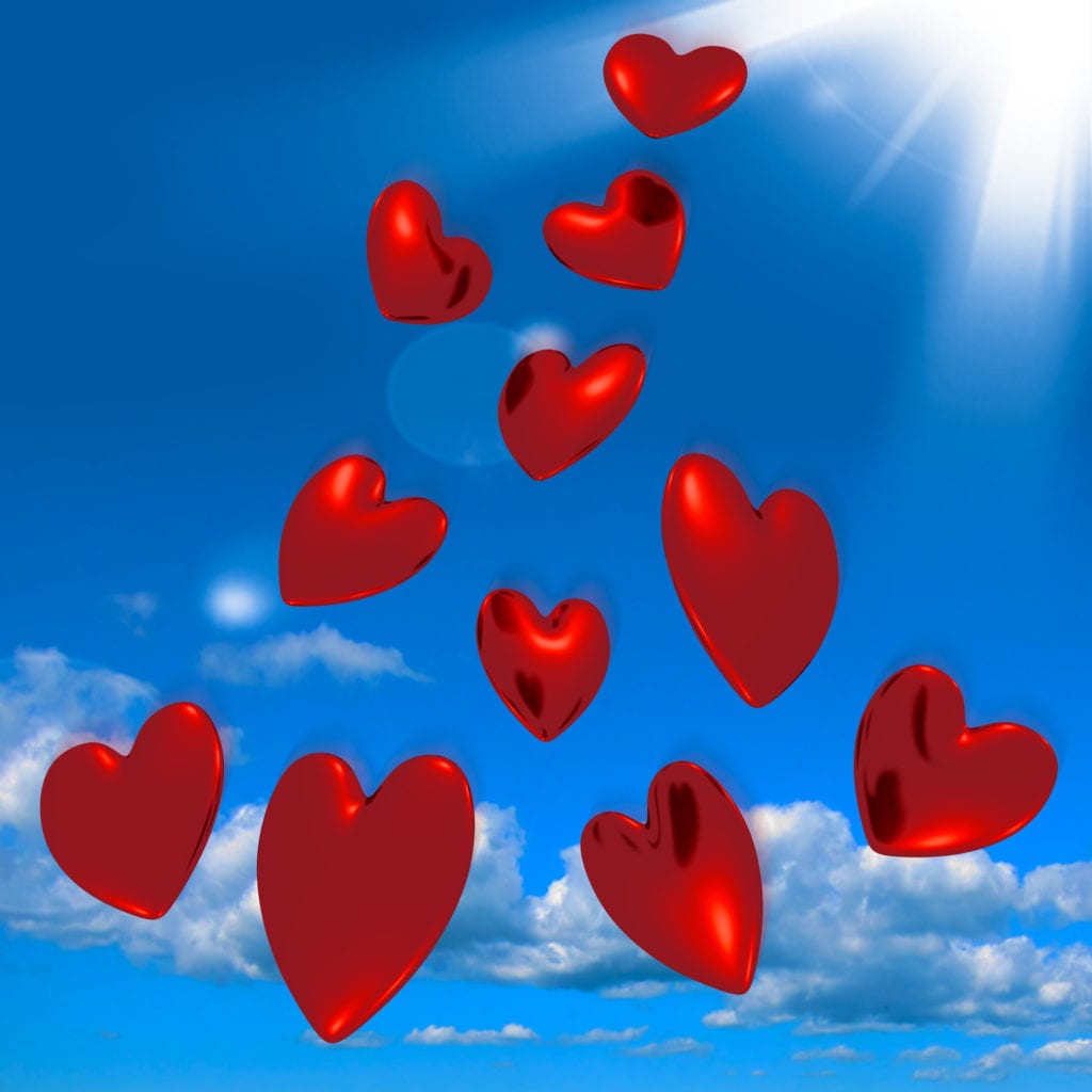 metallic red hearts falling from the sky showing love and romance GyCO6GDu
