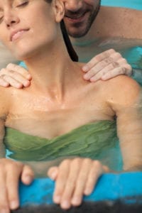 woman receibing a massage inside the pool Hv1ll2hP2fx