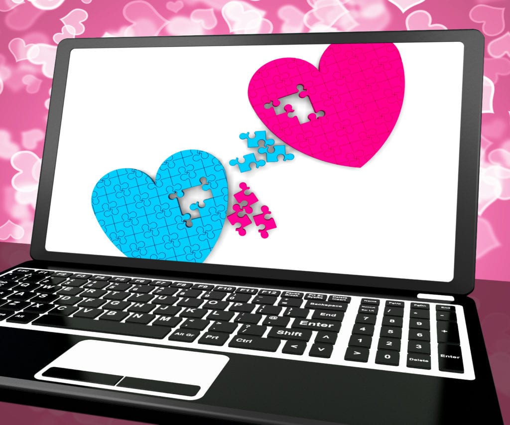 two hearts on laptop shows love and commitment f1z0yXv