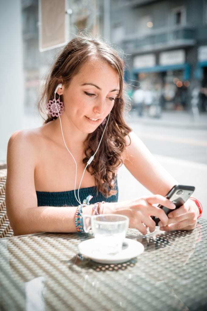 graphicstock young beautiful woman listening to music at the