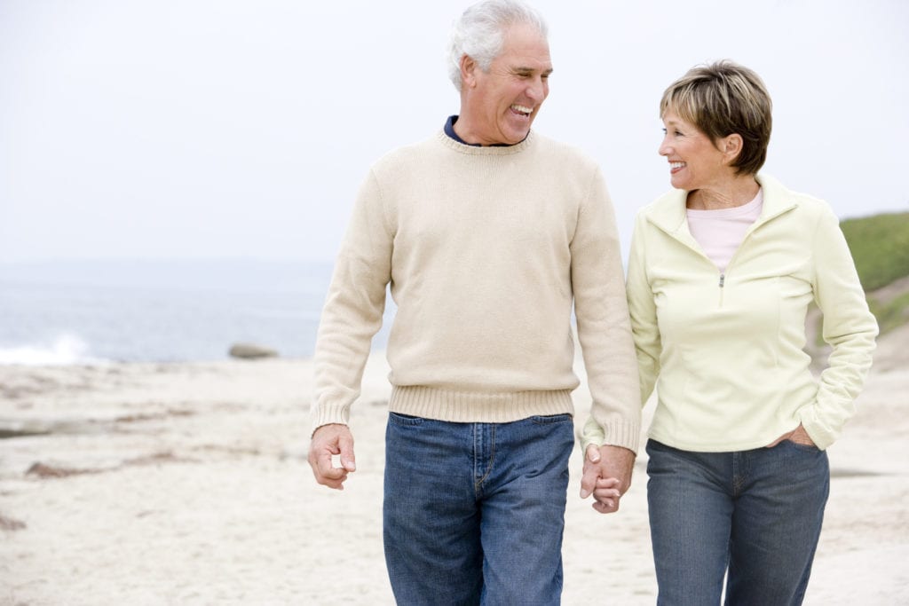 couple at the beach holding hands