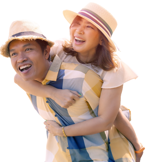 asian couple smiling while girlfriend piggybacks her boyfriend
