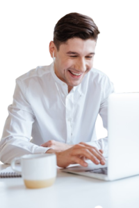 picture of laughing man dressed in white shirt using laptop computer