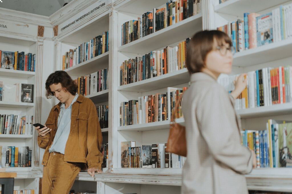 man in brown coat standing beside woman in beige coat