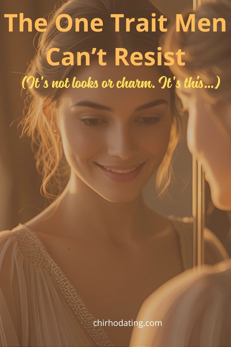 Woman smiling mysteriously at herself in a mirror, capturing the essence of the one trait men can’t resist, with overlay text 'The one trait men can't resist' and subtitle 'It's not looks, or charm. It's this...'