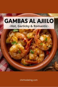 Sizzling garlic shrimp in Spanish clay dish.