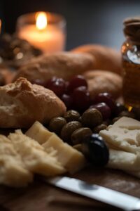 Image of Portuguese cheese board with olives and bread.