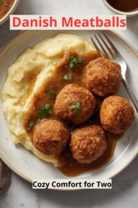 Image of Danish Frikadeller (pan-stirred meatballs) served with mashed potatoes and brown sauce,