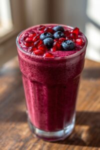 7 Smoothie Recipes for Better Blood Flow Naturally 7 image of a pomegranate and berry smoothie,